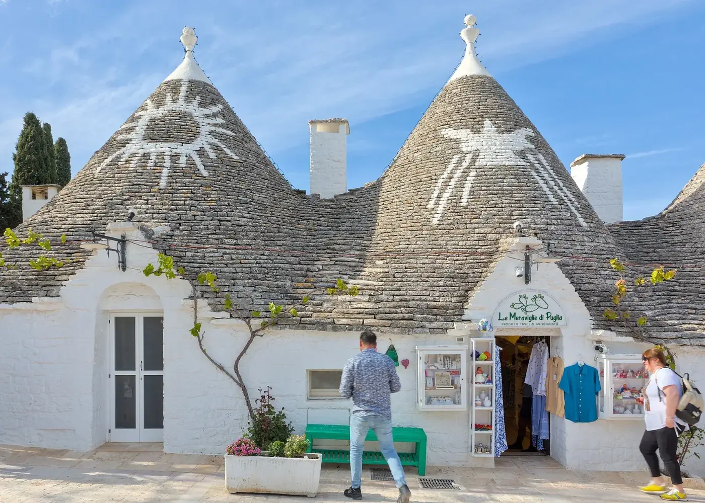 Trulli with painted symbols in Rione Monti, Alberobello