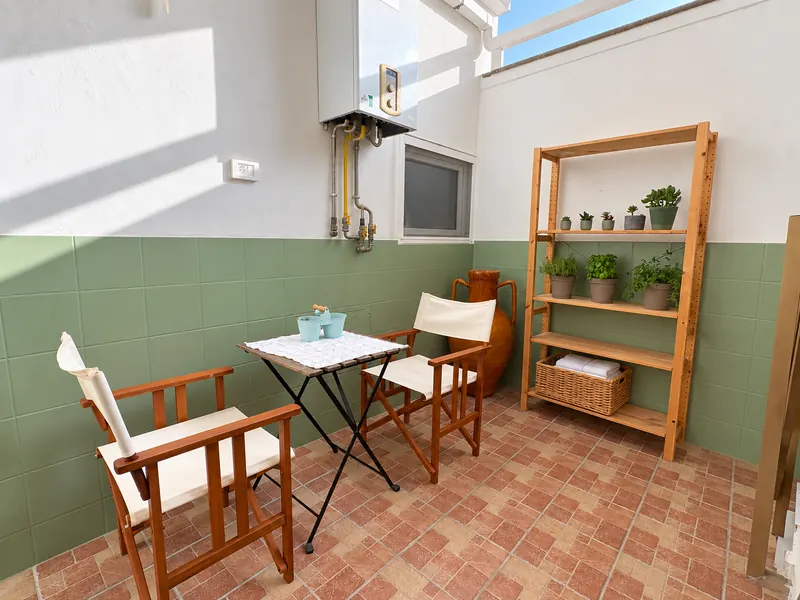 The small private terrace of BDS House with a table for two